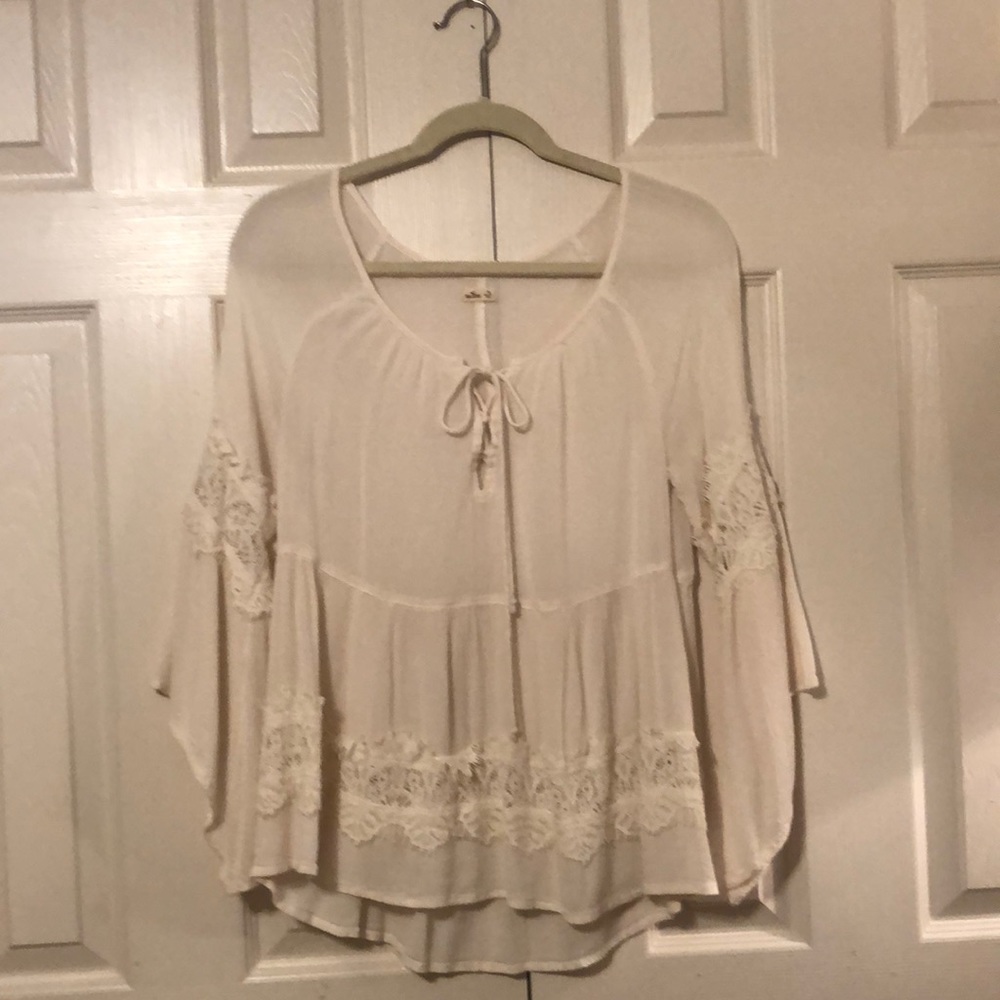 Creme Lace Bell Sleeve Tie Neck Ruffle Hem Top
